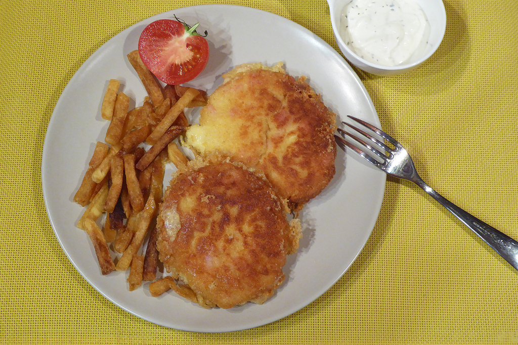 Wild cheese pancakes served with fries and tartar sauce.